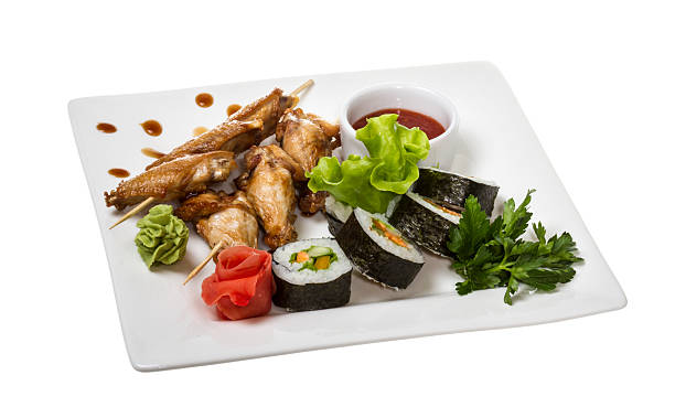 istock Buffalo chicken wings on plate with sushi 178401863