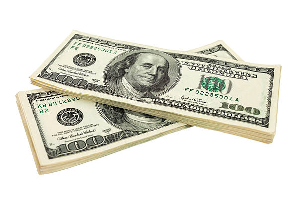 istock Heap of US dollars bills isolated on white background 178401865