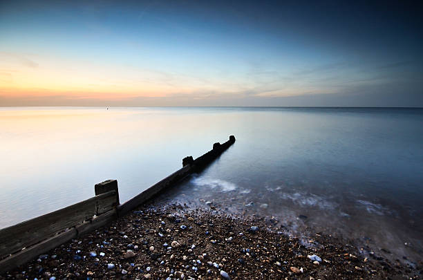 Herne Bay Long exposure of beach divider during sunset in Herne Bay, Kent. herne bay photos stock pictures, royalty-free photos & images