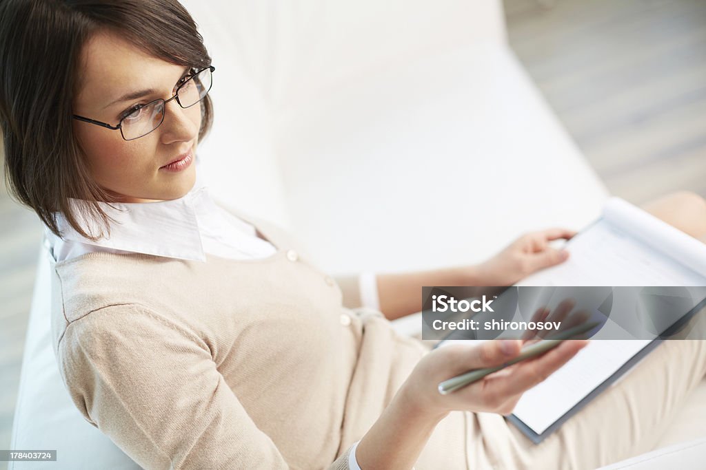 Professional psychiatrist Professional psychiatrist looking at her patient during therapy session Adult Stock Photo