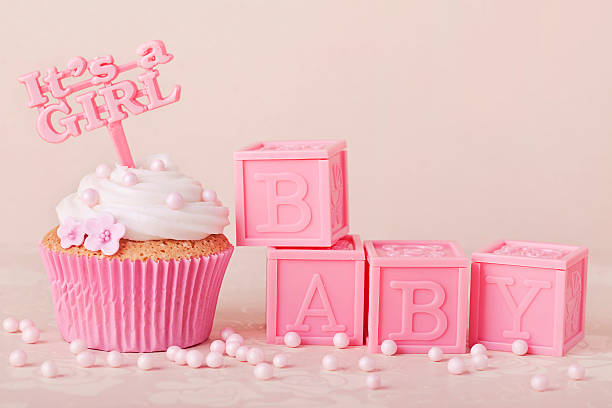 Pink cupcakes with pink baby blocks