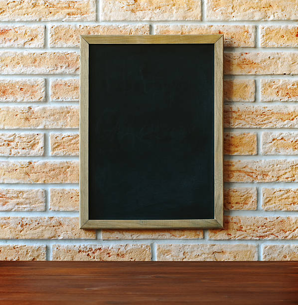 istock Wooden chalk board hanging on brick wall 178404337