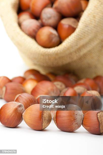 Hazelnuts In A Burlap Bag On White Background Stock Photo - Download Image Now - Autumn, Bag, Brown