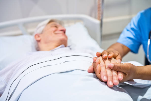 istock Nurse consoling patient lying on gurney 1784056750