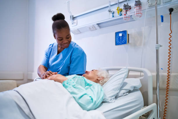istock Nurse consoling senior patient in hospital 1784057324