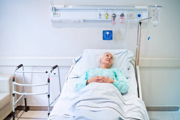 istock Senior patient lying in hospital bed 1784059051