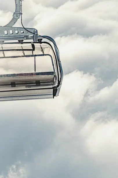 Chairlifts in the ski resort of lenzerheide, switzerland with and without clouds