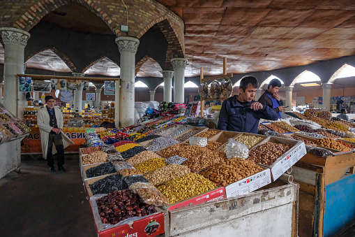 Panjakent, Tajikistan - November 8, 2023: Dry fruit sellers at the Central Bazaar in Panjakent, Tajikistan.