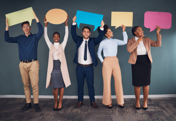 istock Diversity, staff and business people with speech bubbles, communications or ideas for new project. Multiracial, female coworkers or male employees with feedback, sign or voices with opinion and smile 1784076271