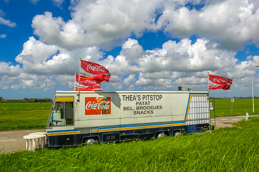 Typical dutch sack car in a dutch  landscape. Food trucks are a common thing in Holland. Many Dutch people use the food cars for a lunch snack.