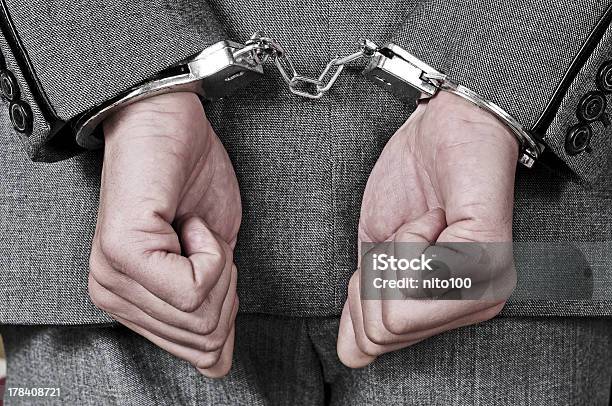 Handcuffed Man Stock Photo - Download Image Now - Adult, Arrest, Handcuffs