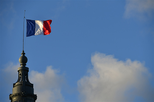 Paris, France-11 07 2023: French flag fluttering in the wind, Paris, France.