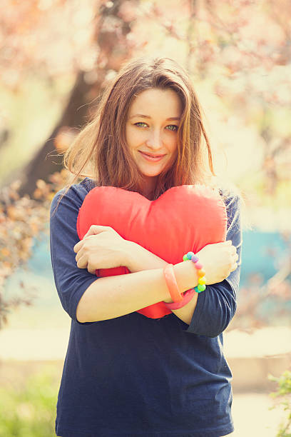 istock Romantic girl with heart near tree 178409101