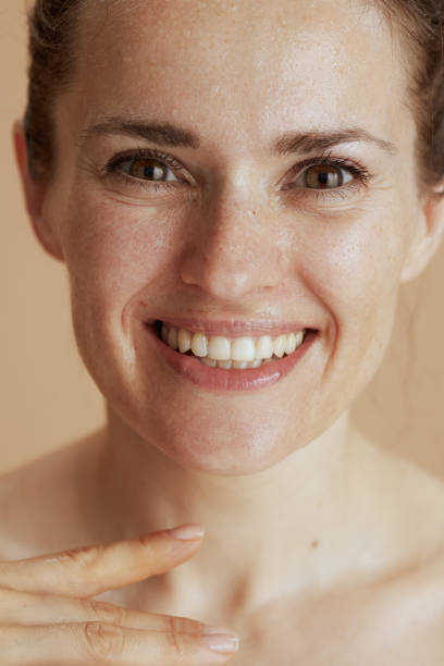 istock happy modern female with wet face washing 1784092717