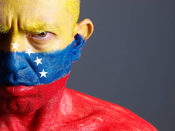 istock Man and his face painted with Venezuelan flag. 178409366