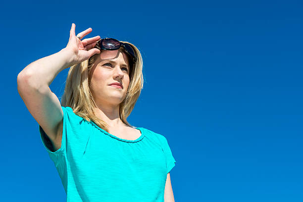 istock Woman raising sunglasses 178409623