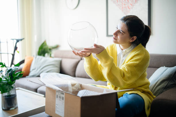 istock Checking out the delivered item for damages. 1784097259
