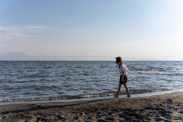 istock Girl walking on the beach. 1784097793