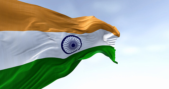 Close-up of India national flag waving on a clear day. Tricolor of saffron, white and green with a blue Ashoka Chakra in the center. 3d illustration render. Fluttering textile