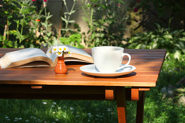 istock Coffee and book in garden 178409971