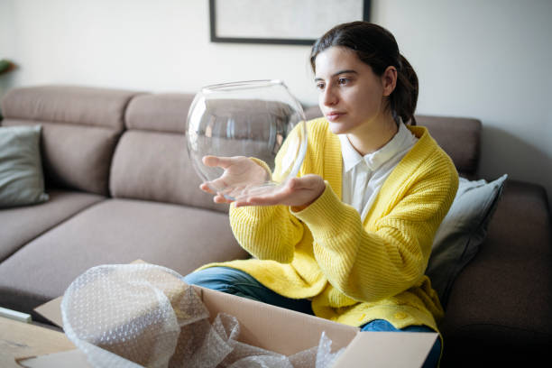 istock Checking out the delivered item for damages. 1784100318