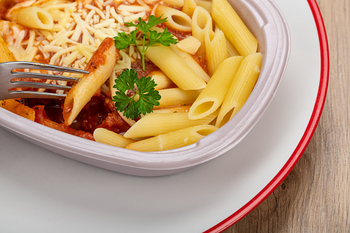 Tomato Pasta Ready Meal, on a plate in it's packet