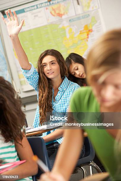 A Female Student Answering A Question In Class Stock Photo - Download Image Now - High School Student, Classroom, High School