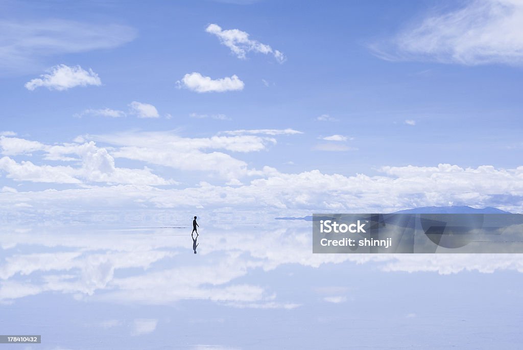 Walking Man in Salar de Uyuni, Bolivia Walking Man in Salar de Uyuni, Bolivia. Salar de Uyuni Stock Photo