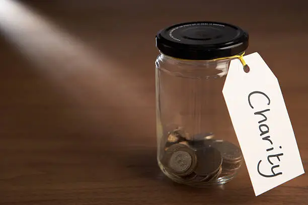 Photo of Coins in a jam jar