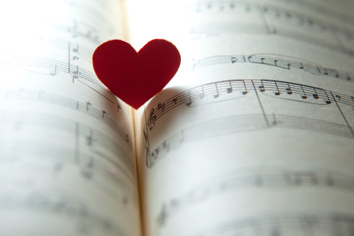 heart shape on a music note book. shallow DOF