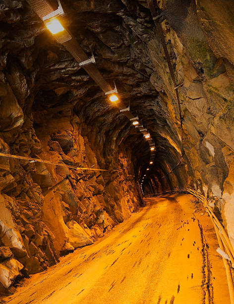 istock Dark mine tunnel with lights, marble quarry underground 178410715