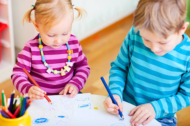 istock Brother and sister drawing in their room 178410811