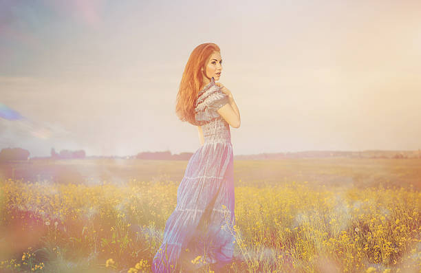 istock lady in spring meadow flowers 178410865