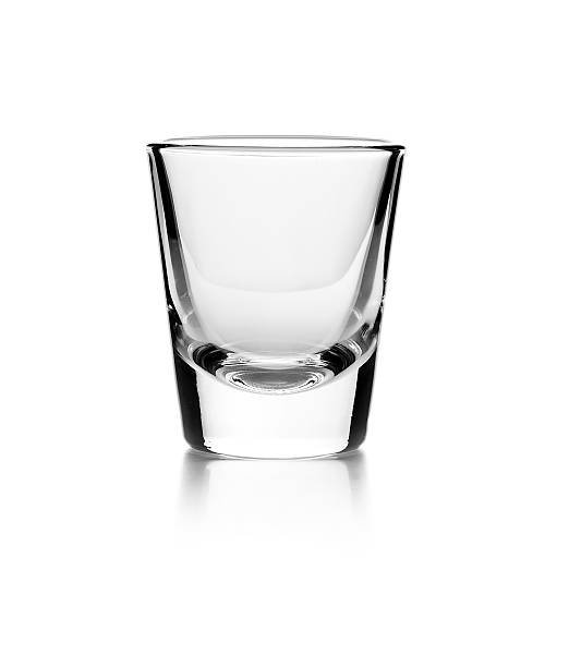 Empty glass Empty glass on a reflective surface on white background shot glass stock pictures, royalty-free photos & images