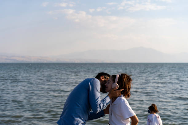 Father and daughter on the beach. Father's Day concept.