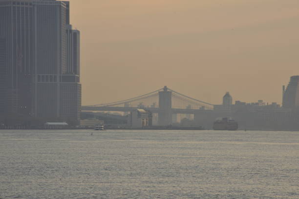 istock The East River And Silhouetted Brooklyn Bridge During Sunrise 1784120590