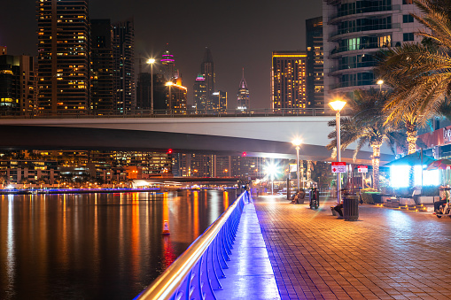 Dubai, United Arab Emirates - October 12, 2023: Dubai Marina canal with boats in Dubai at night