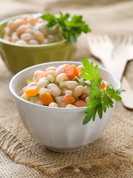 Bean salad with carrot, cucumber and apple, selective focus