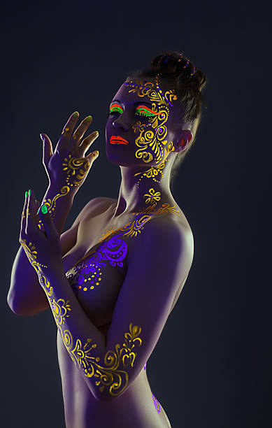istock Elegant model with yellow UV pattern on body 178413340