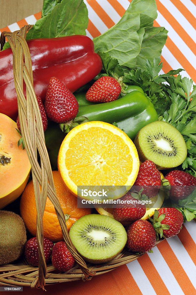 Healthy diet - sources of Vitamin C Healthy diet - sources of Vitamin C - oranges, strawberry, bell pepper capsicum, kiwi fruit, paw paw, spinach dark leafy greens and parsley. Vertical. Alternative Medicine Stock Photo