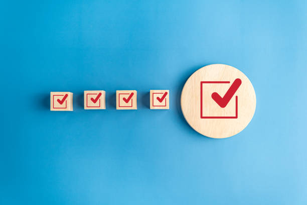 istock Checklist concept, correct mark, check mark on wooden block, blue background. 1784136771