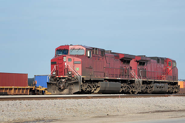 istock Two red locomotives at a freight yard 178413724