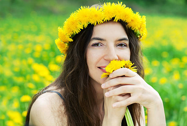 istock Woman with dandelions 178414318