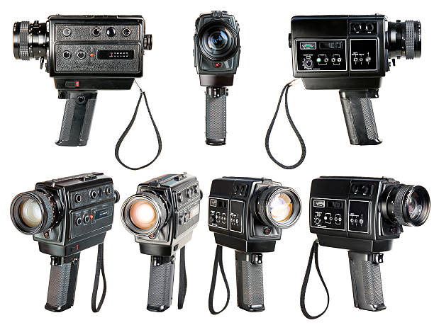 Modern Digital Cinema Camera with Moto Zoom Telephoto Lens Attached in Blue and Red Film Stage Illumination Close Up. Film Industry Equipment.