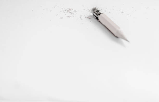 istock Eraser and small pencil on white paper with empty space 1784148779