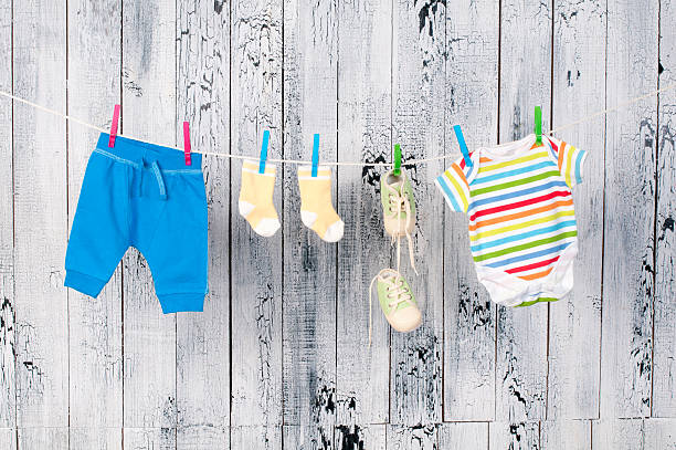 istock Baby clothes hanging on the clothesline. 178415623