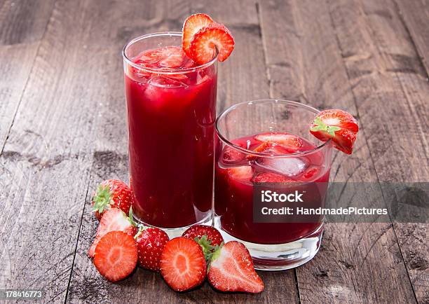 Some Glasses With Strawberry Liqueur Stock Photo - Download Image Now - Strawberry Juice, Strawberry Smoothie, Alcohol - Drink