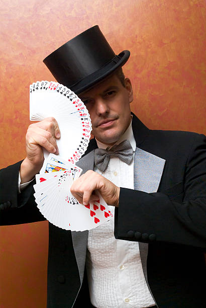 istock Magician performing with cards 178416884