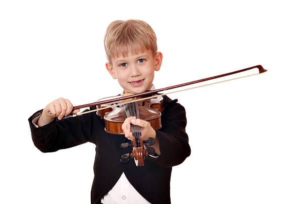 istock happy boy play music on violin 178416937