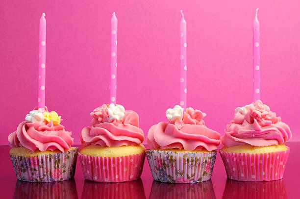 Pink brithday cupcakes with polka dot candles